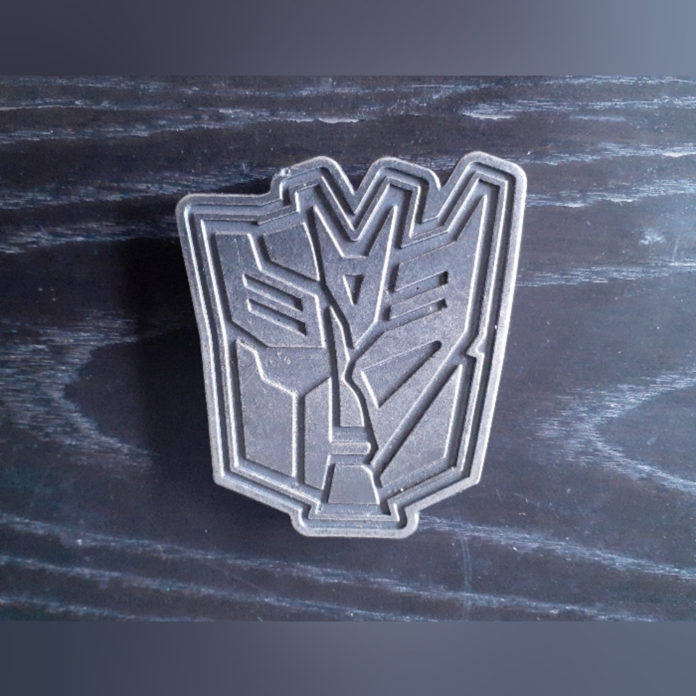 Transformers belt buckle